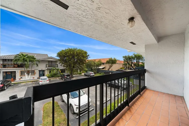 a view of a balcony with wooden floor