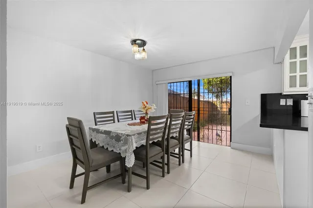a view of a dining room with furniture and window