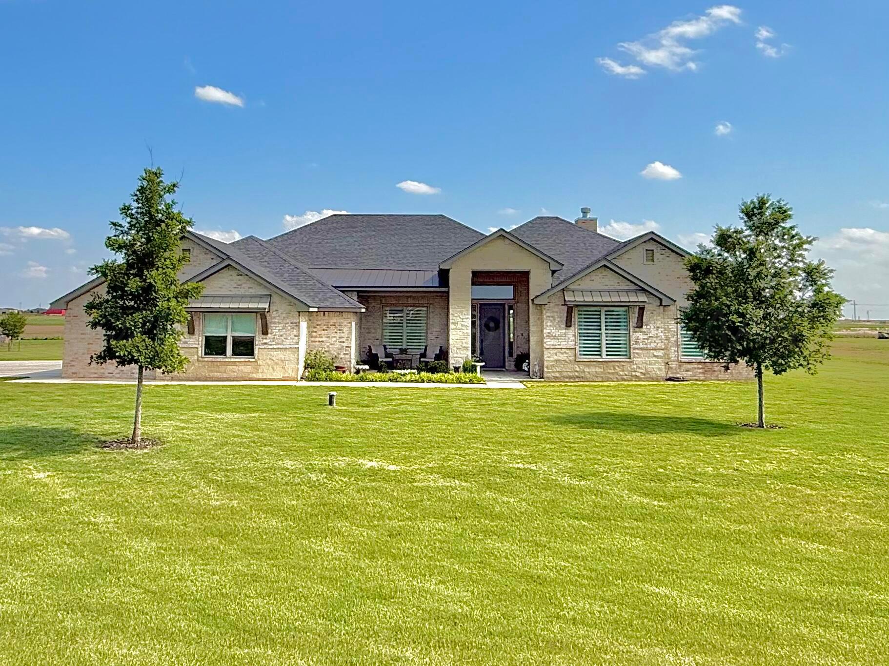 19081 Elk Springs Road Amarillo, TX 79119 - Photo 1 of 41 a front view of a house with a garden