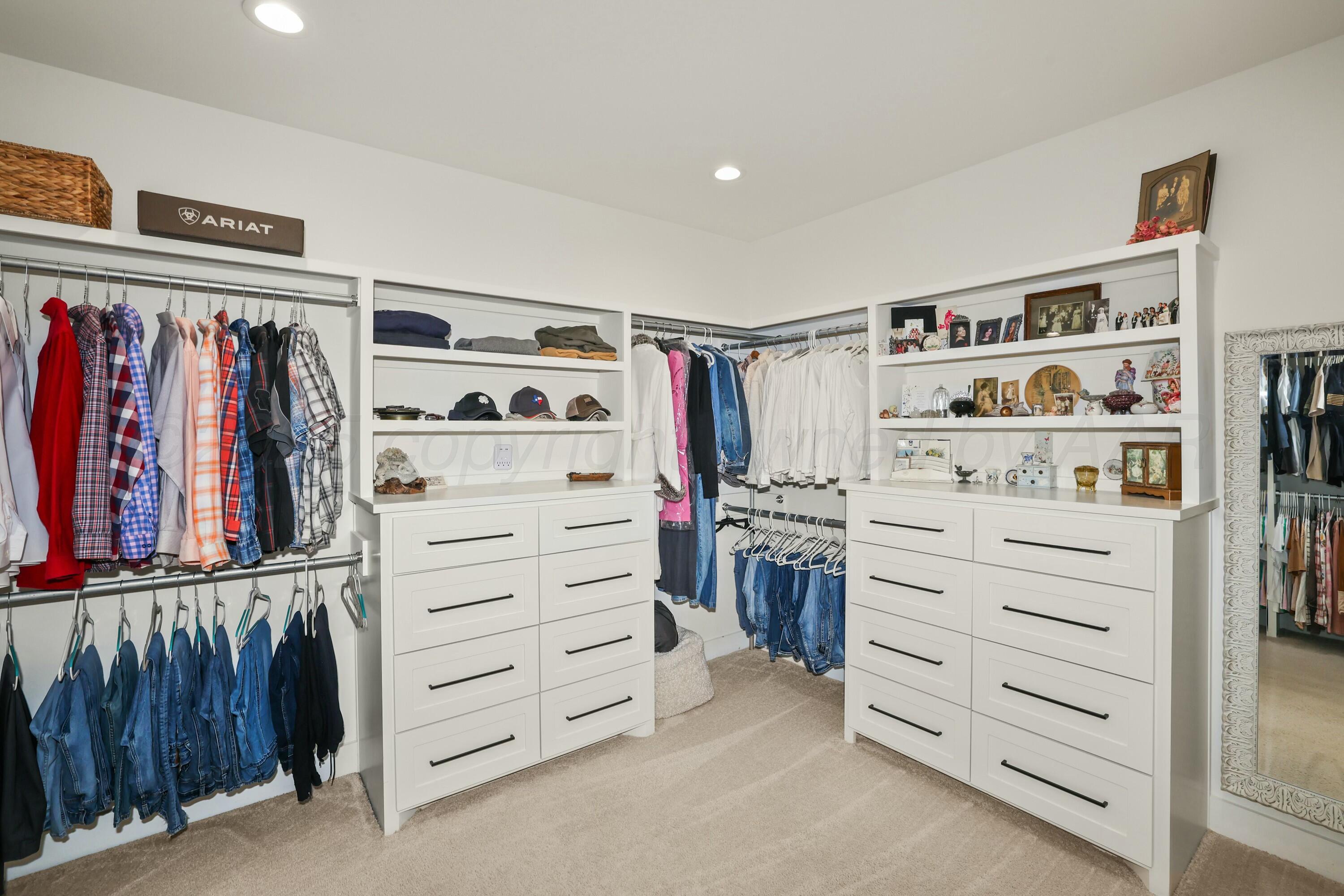19081 Elk Springs Road Amarillo, TX 79119 - Photo 25 of 41 a view of walk in closet with clothes and shoes