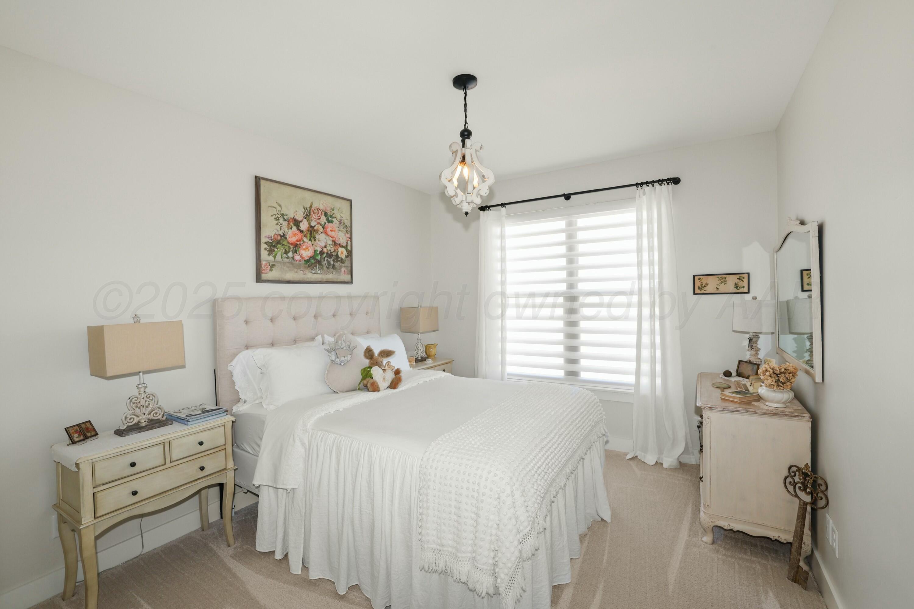 19081 Elk Springs Road Amarillo, TX 79119 - Photo 29 of 41 a bedroom with a bed and a window