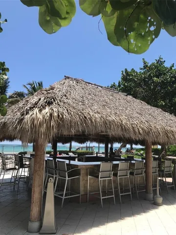 a view of a chairs and table in the patio