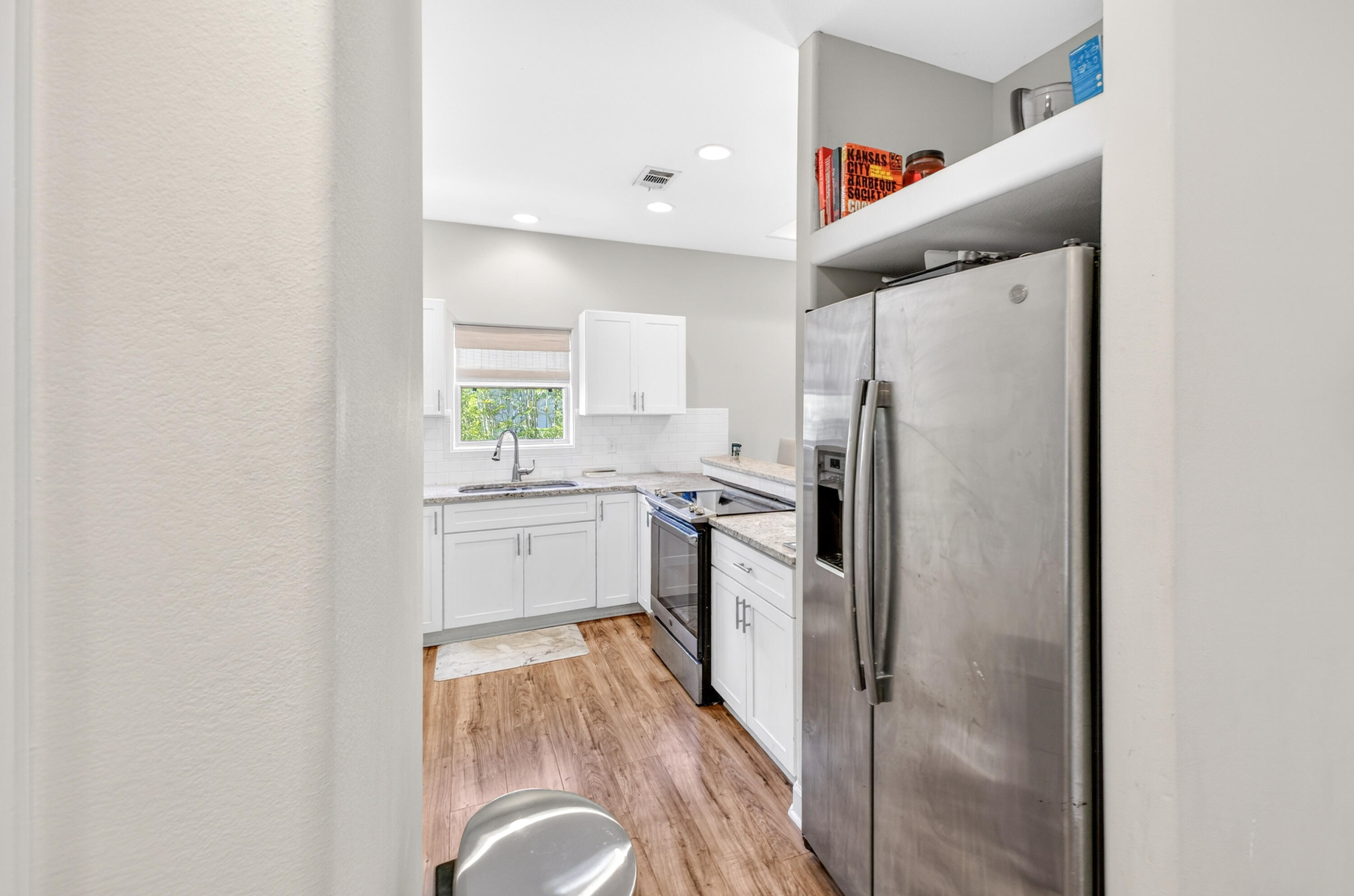 56 East Shallows Drive Santa Rosa Beach, FL 32459 - Photo 11 of 54 a kitchen with a refrigerator sink and stove