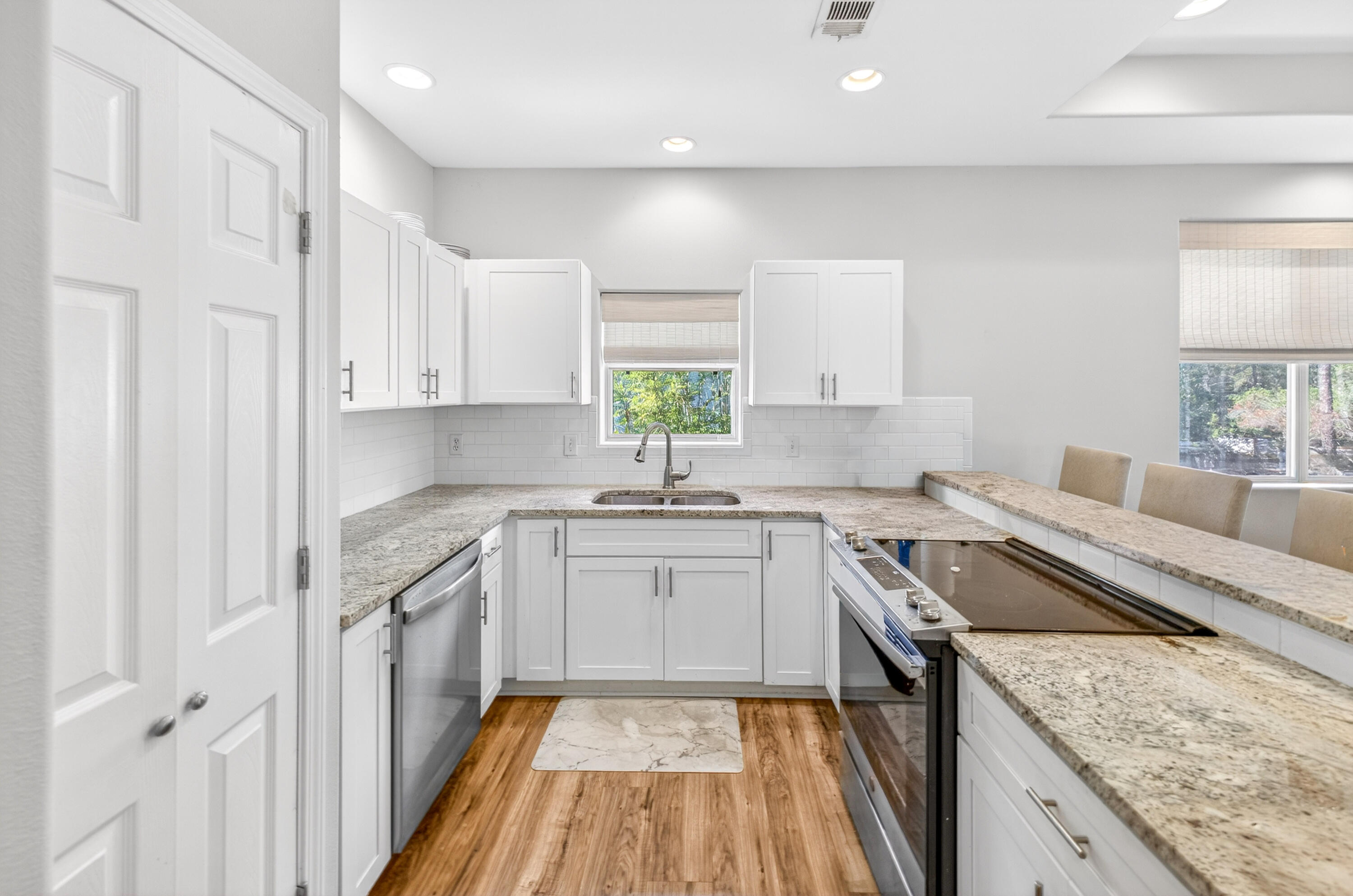 56 East Shallows Drive Santa Rosa Beach, FL 32459 - Photo 12 of 54 a kitchen with a sink stove and cabinets