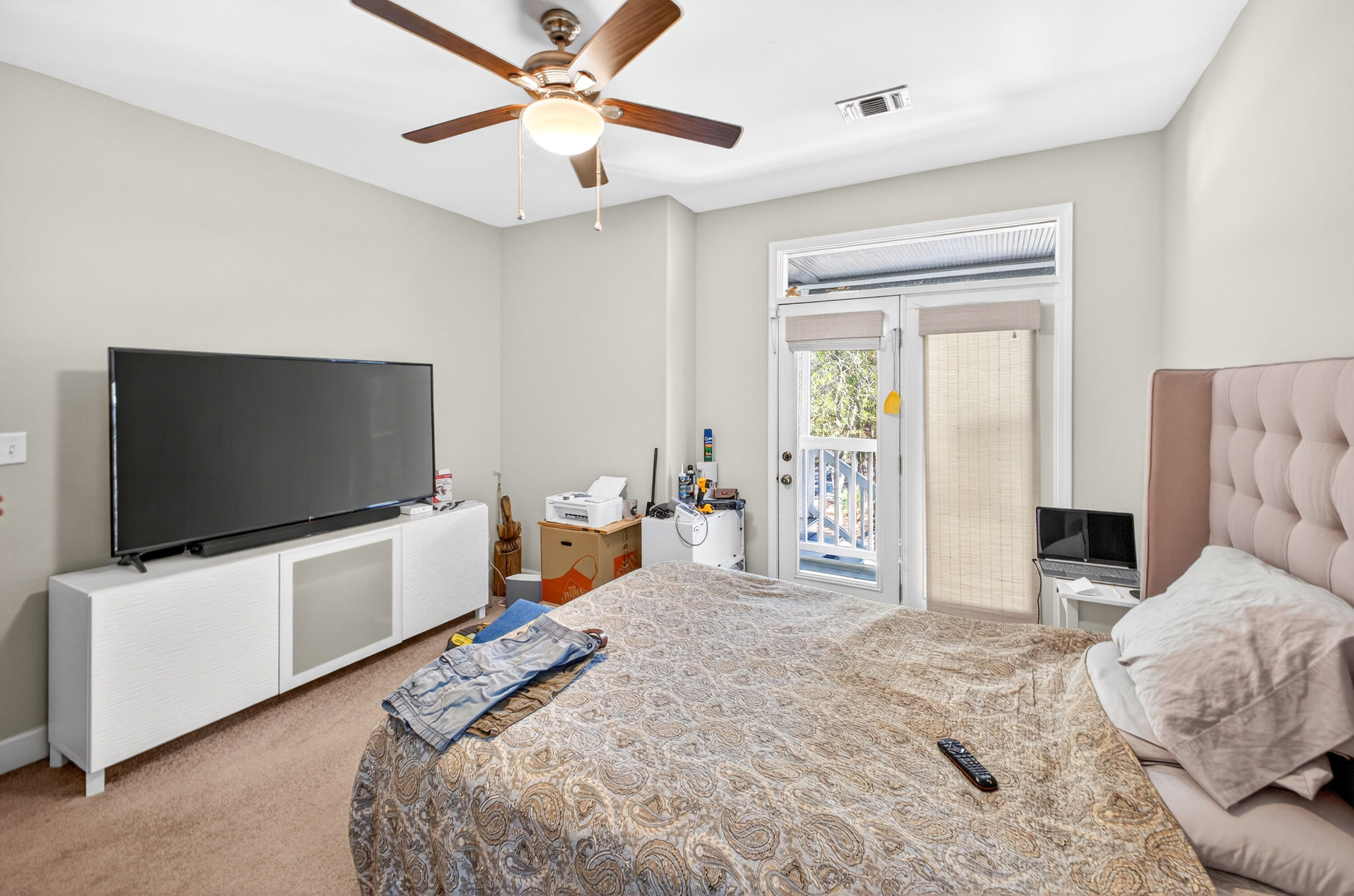 56 East Shallows Drive Santa Rosa Beach, FL 32459 - Photo 14 of 54 a bedroom with furniture and a flat screen tv