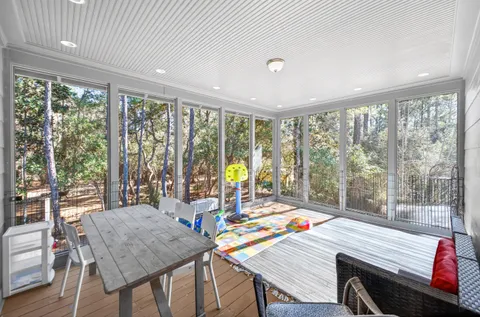 a view of a dining room with furniture window and outside view