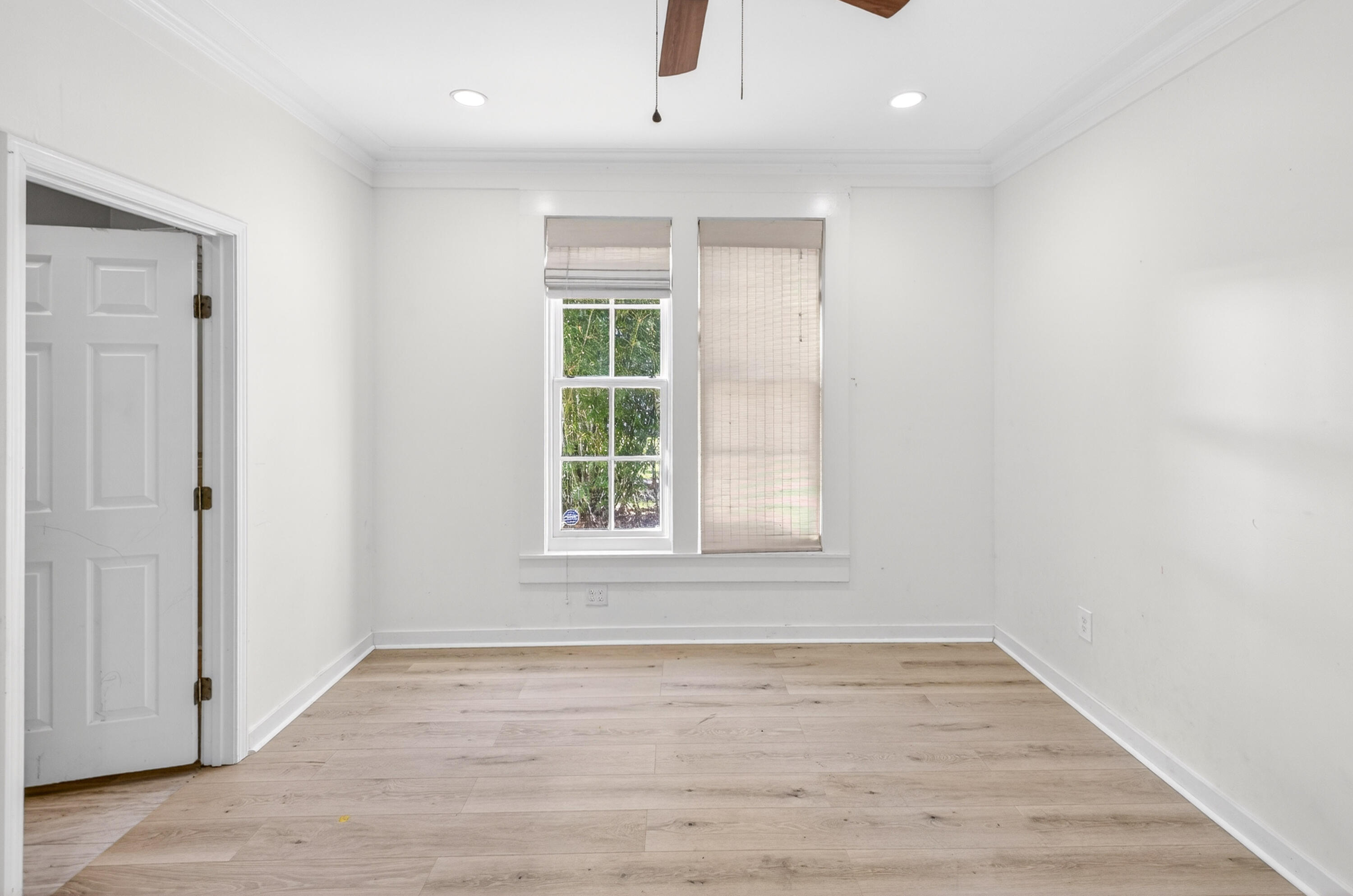 56 East Shallows Drive Santa Rosa Beach, FL 32459 - Photo 31 of 54 an empty room with wooden floor and windows