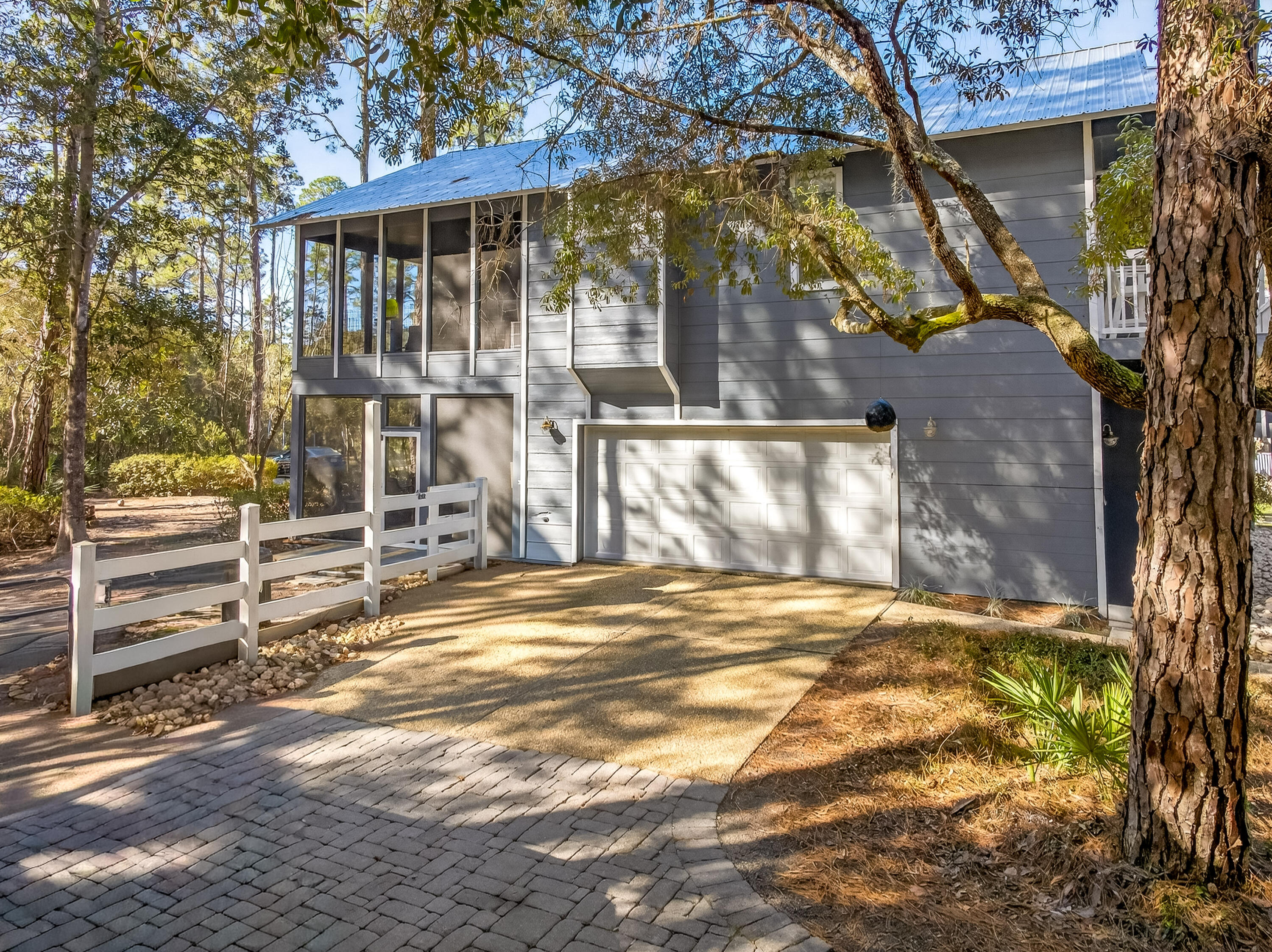 56 East Shallows Drive Santa Rosa Beach, FL 32459 - Photo 4 of 54 a front view of a house with a yard