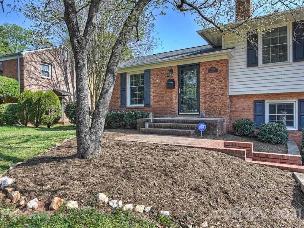 5121 Murrayhill Road Charlotte, NC 28210 - Photo 2 of 47 a front view of a house with garden