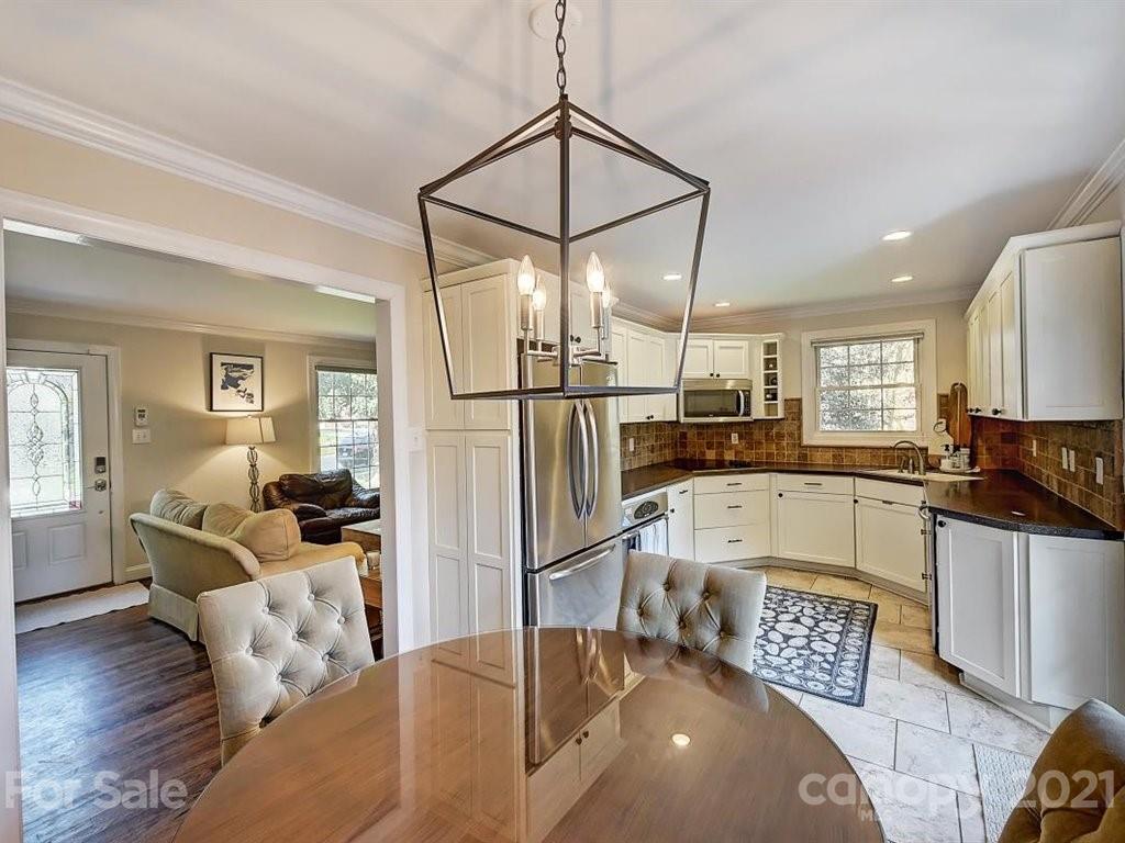 5121 Murrayhill Road Charlotte, NC 28210 - Photo 13 of 47 a kitchen with stainless steel appliances granite countertop a refrigerator a stove and a sink