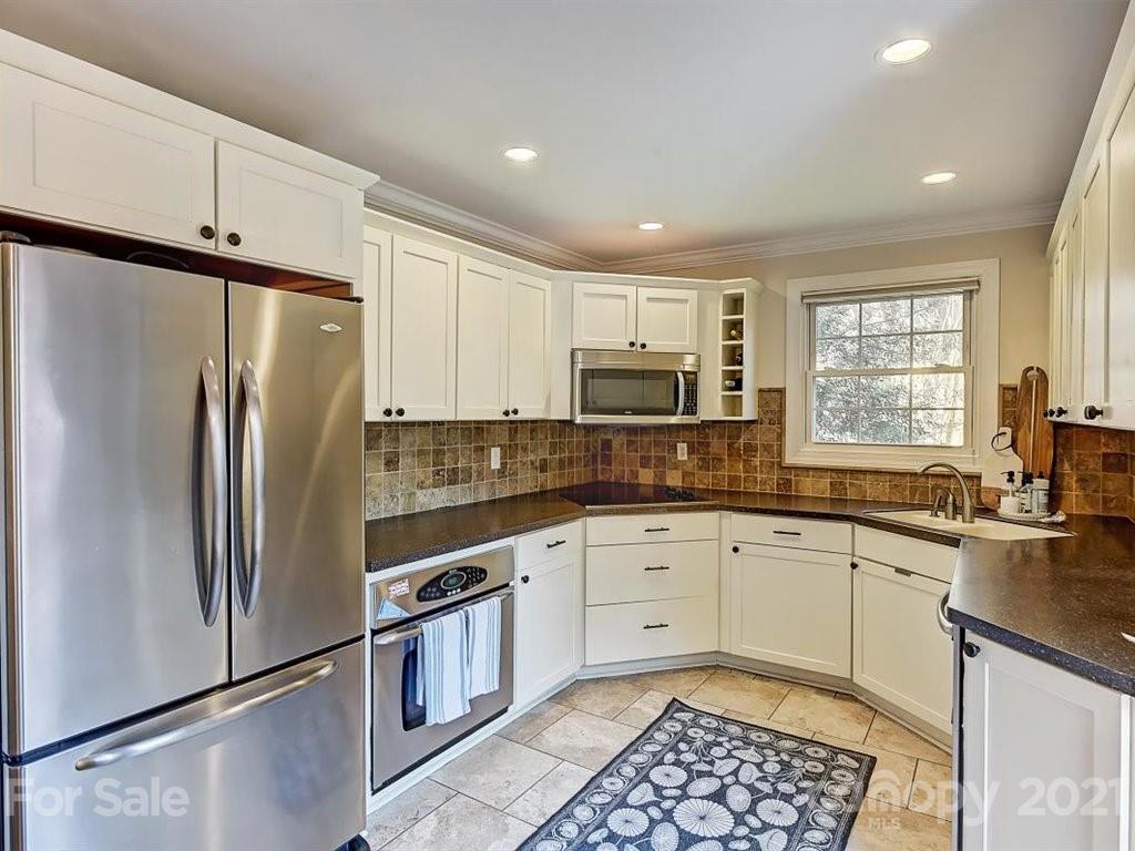 5121 Murrayhill Road Charlotte, NC 28210 - Photo 16 of 47 a kitchen with stainless steel appliances granite countertop a refrigerator sink and stove