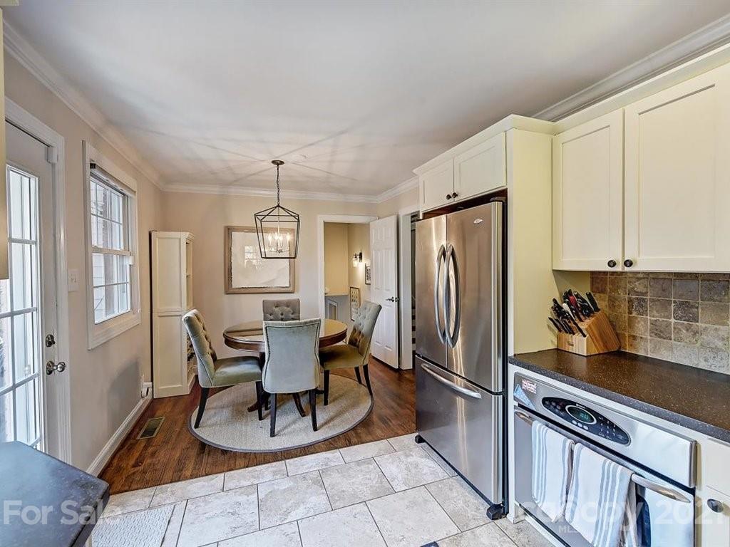 5121 Murrayhill Road Charlotte, NC 28210 - Photo 18 of 47 a dining room with stainless steel appliances granite countertop furniture and a window