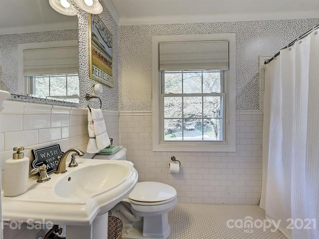 5121 Murrayhill Road Charlotte, NC 28210 - Photo 19 of 47 a bathroom with a sink a toilet and shower