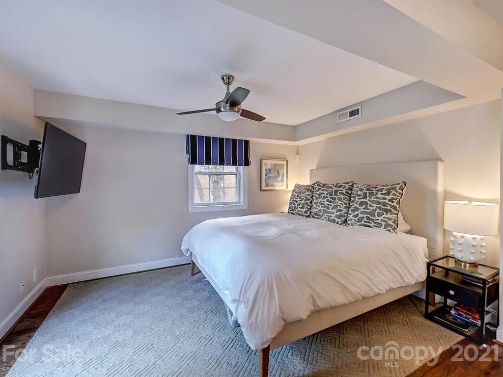 5121 Murrayhill Road Charlotte, NC 28210 - Photo 27 of 47 a bedroom with a bed and a tv