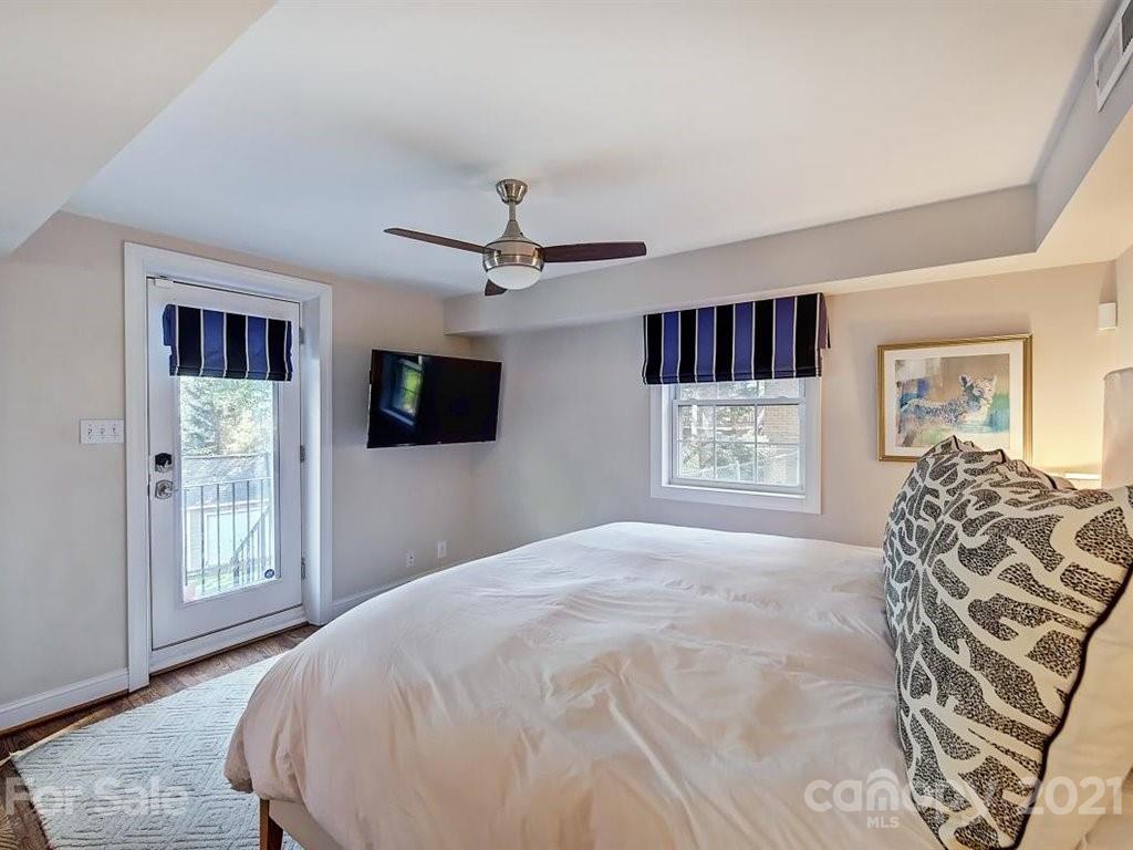 5121 Murrayhill Road Charlotte, NC 28210 - Photo 28 of 47 a bedroom with a bed and a television