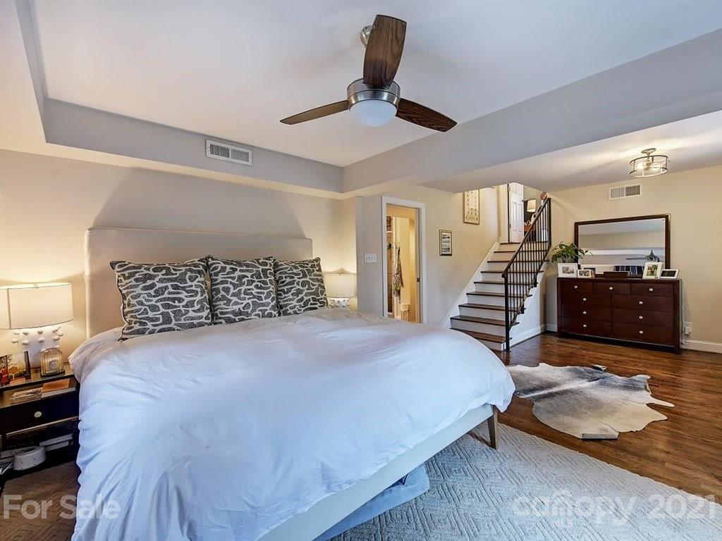 5121 Murrayhill Road Charlotte, NC 28210 - Photo 29 of 47 a bedroom with a bed and ceiling fan