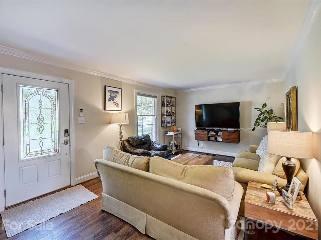 5121 Murrayhill Road Charlotte, NC 28210 - Photo 4 of 47 a living room with furniture a flat screen tv and a large window