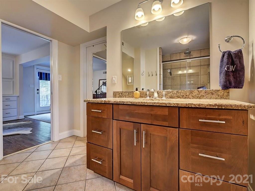 5121 Murrayhill Road Charlotte, NC 28210 - Photo 32 of 47 a bathroom with a granite countertop sink and a mirror