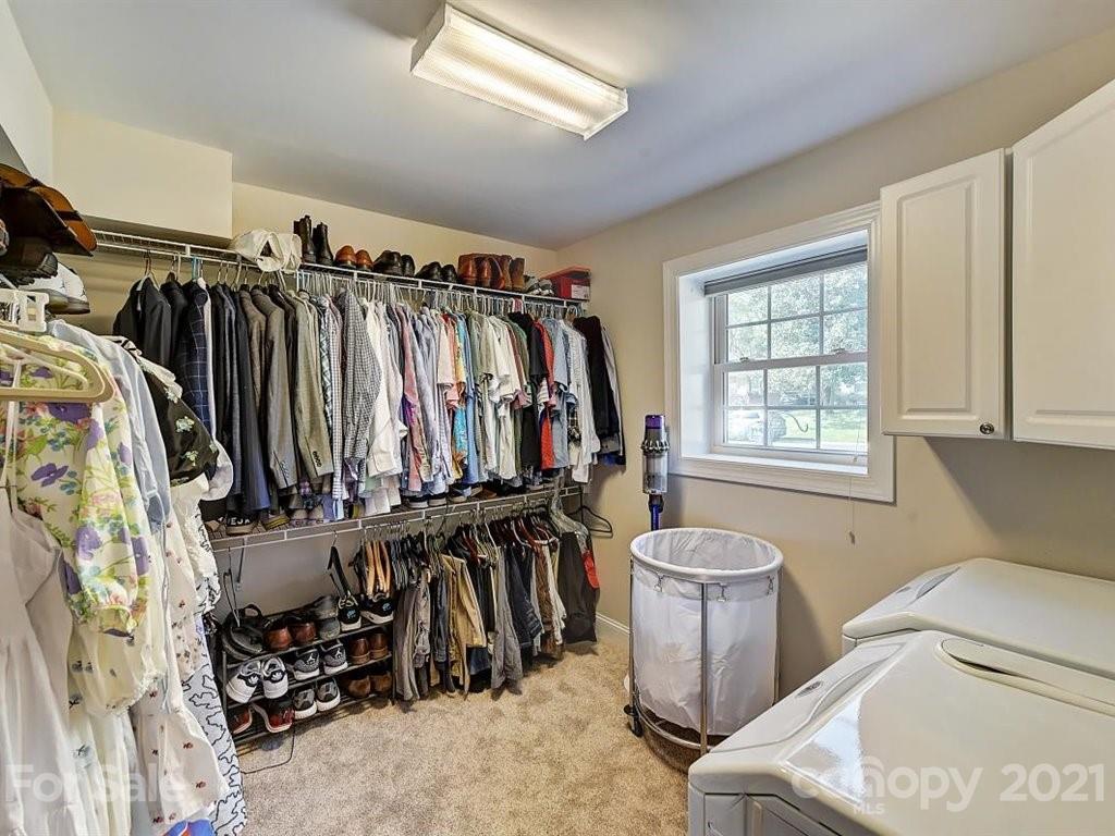 5121 Murrayhill Road Charlotte, NC 28210 - Photo 33 of 47 a view of walk in closet with clothes and shoes