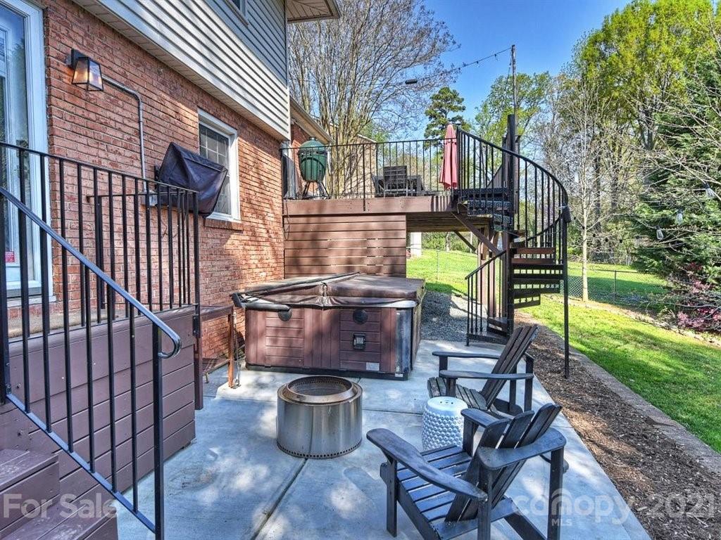 5121 Murrayhill Road Charlotte, NC 28210 - Photo 39 of 47 a view of a chair and tables in the backyard of the house
