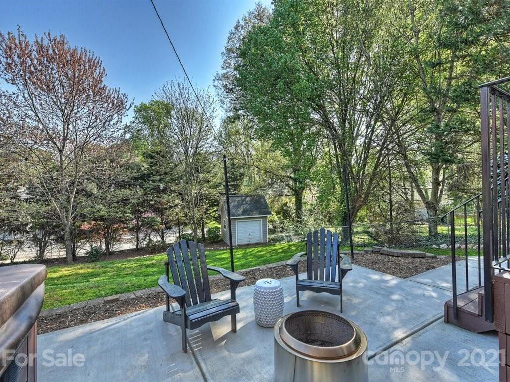 5121 Murrayhill Road Charlotte, NC 28210 - Photo 40 of 47 a patio with a fountain table and chairs