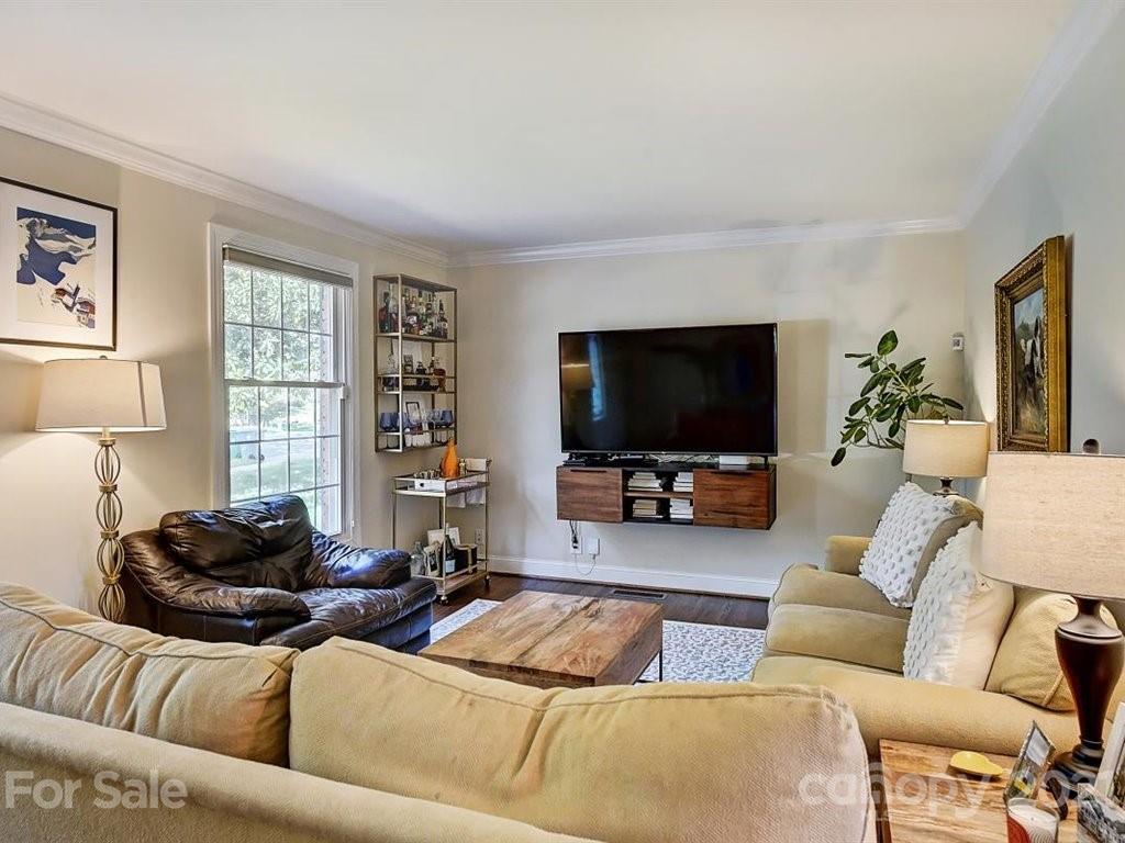 5121 Murrayhill Road Charlotte, NC 28210 - Photo 5 of 47 a living room with furniture and a flat screen tv