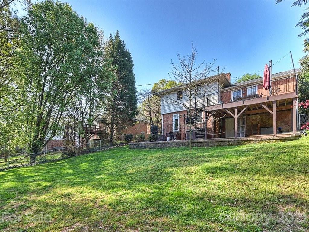 5121 Murrayhill Road Charlotte, NC 28210 - Photo 45 of 47 a view of a house with a big yard and large trees