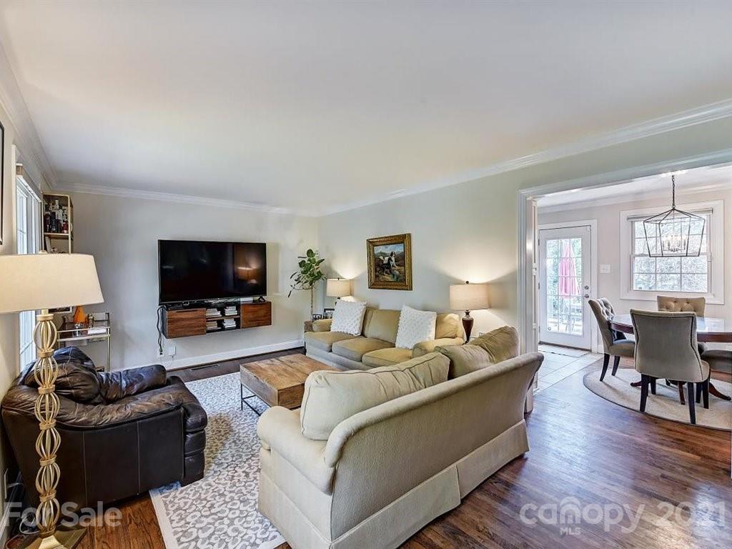 5121 Murrayhill Road Charlotte, NC 28210 - Photo 6 of 47 a living room with furniture a flat screen tv and a fireplace