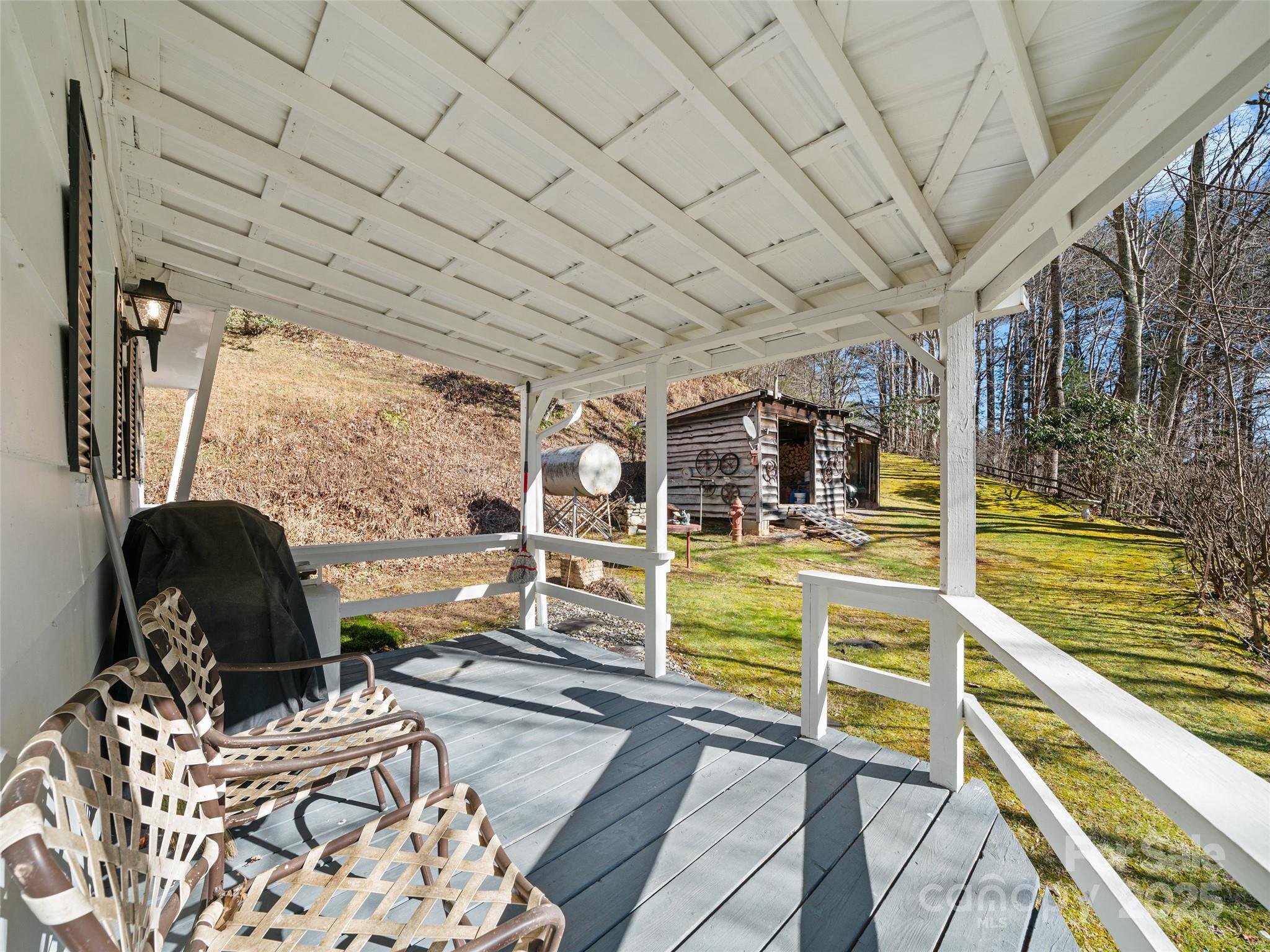 2850 Henson Creek Road Newland, NC 28657 - Photo 18 of 27 a view of a chairs and table in patio