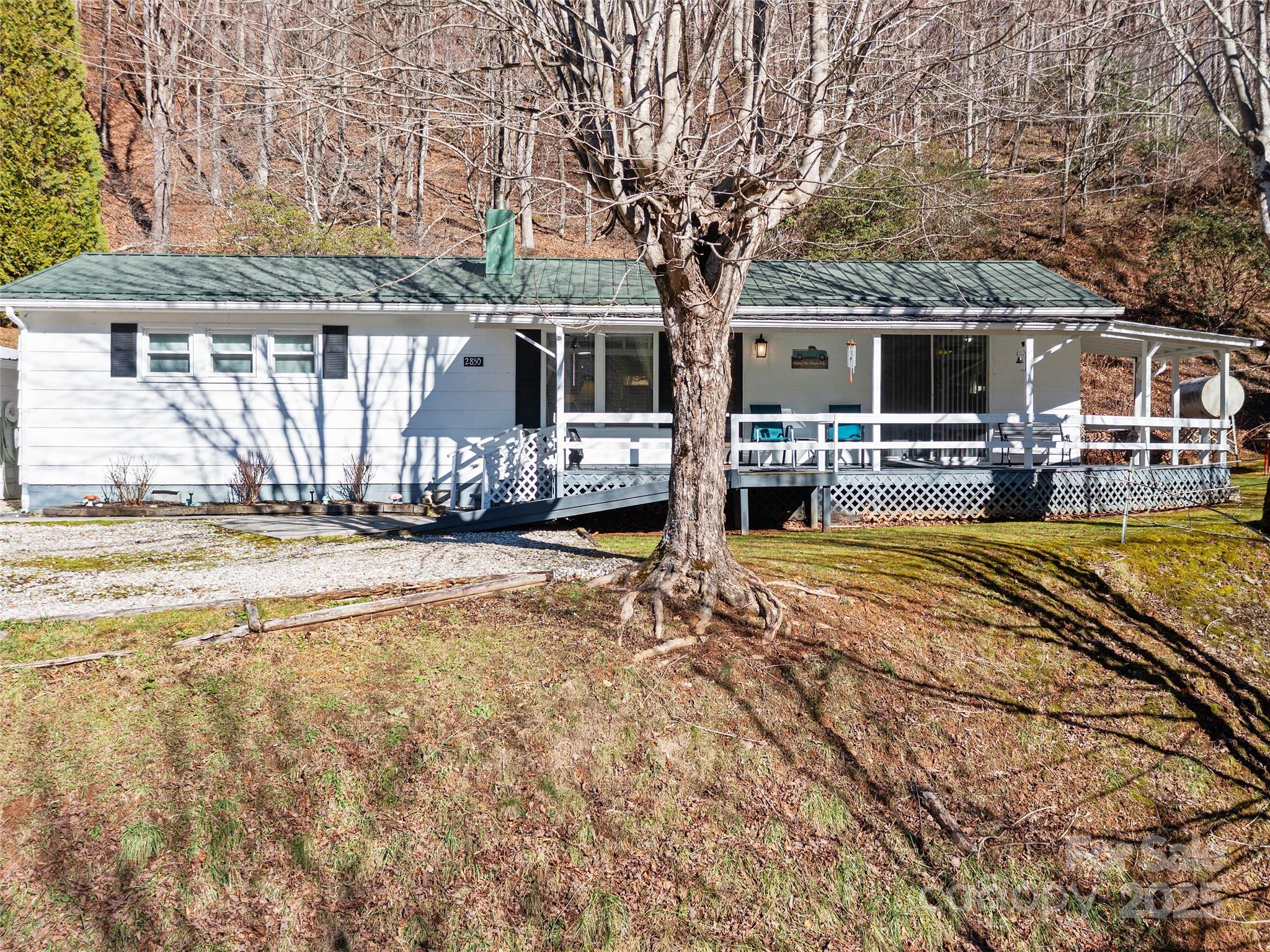 2850 Henson Creek Road Newland, NC 28657 - Photo 27 of 27 a house view with a sitting space and garden space