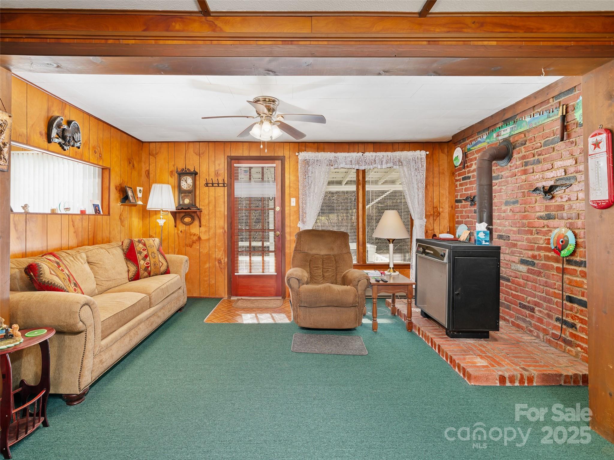 2850 Henson Creek Road Newland, NC 28657 - Photo 3 of 27 a living room with furniture and a floor to ceiling window