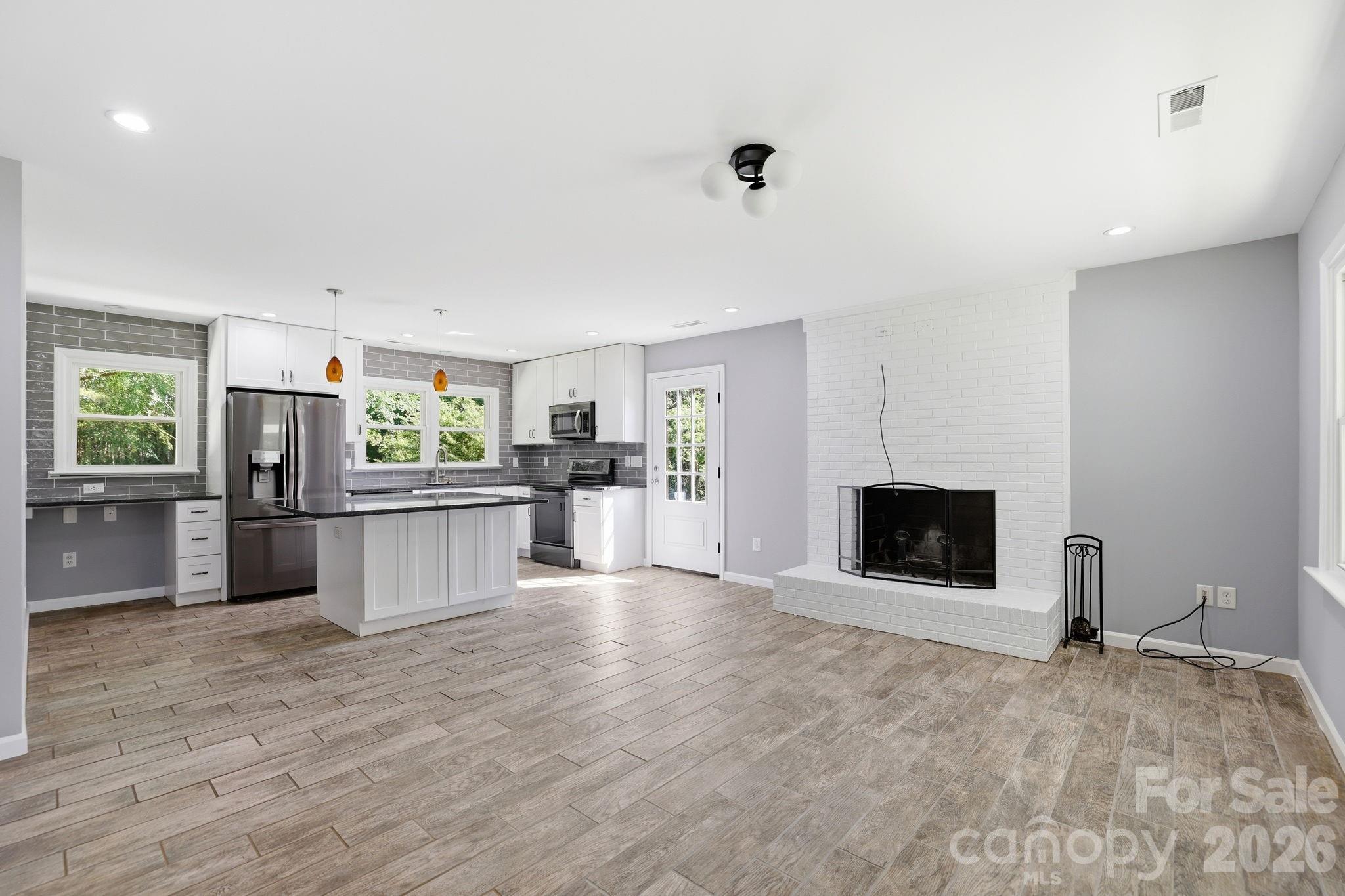 1108 Willoughby Road Monroe, NC 28110 - Photo 22 of 48 a view of a kitchen with microwave and refrigerator