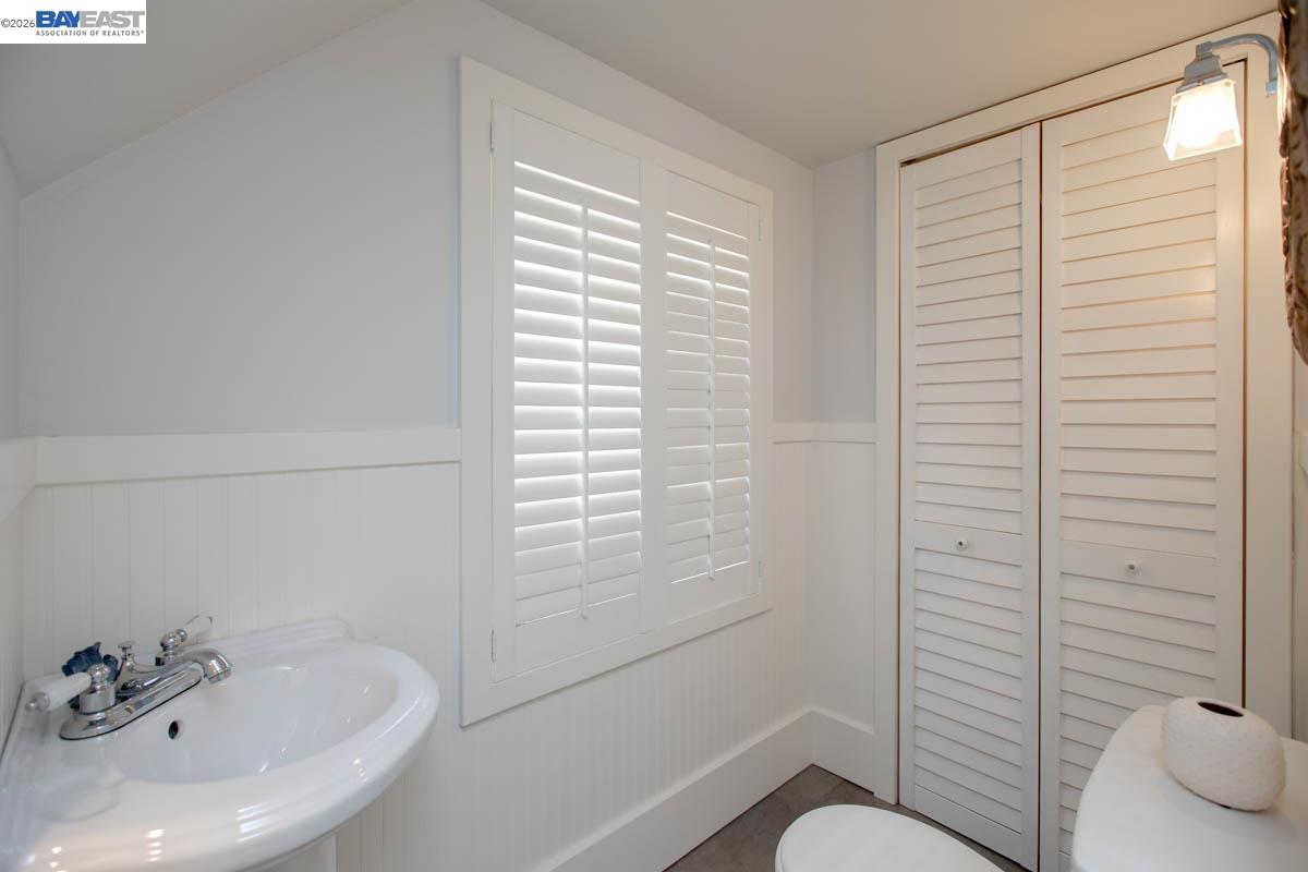 1111 Union Street Alameda, CA 94501 - Photo 30 of 57 a bathroom with a sink and a toilet
