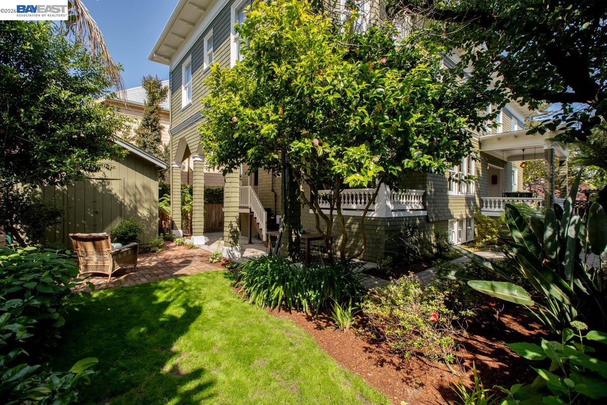 1111 Union Street Alameda, CA 94501 - Photo 57 of 57 a view of a patio with table and chairs and potted plants and large trees