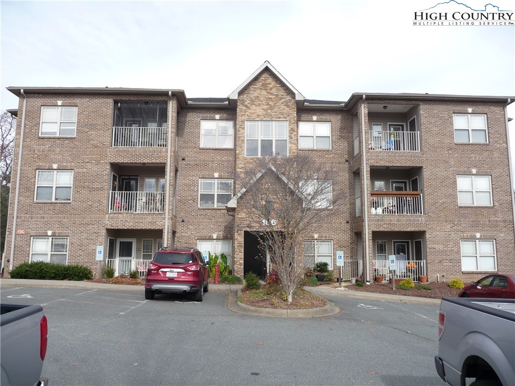 186 Cecil Miller Road, Unit 202 Boone, NC 28607 - Photo 1 of 15 a front view of a building with parking
