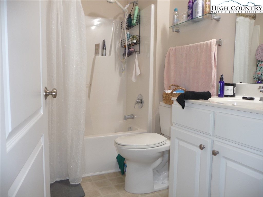 186 Cecil Miller Road, Unit 202 Boone, NC 28607 - Photo 8 of 15 a bathroom with a sink a toilet and shower