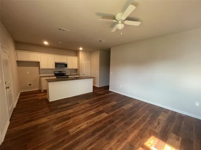 a view of kitchen with wooden floor