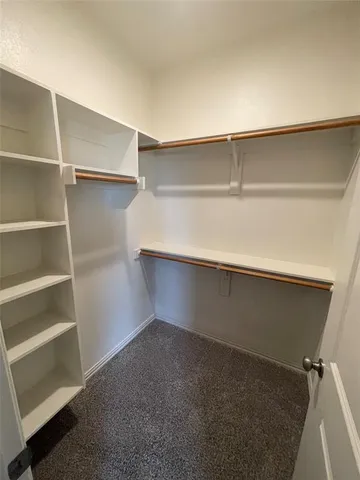 a view of an empty walk in closet