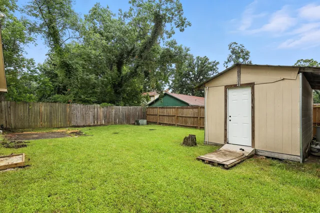 a backyard of a house with lots of green space
