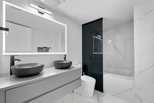 a bathroom with a toilet and a sink