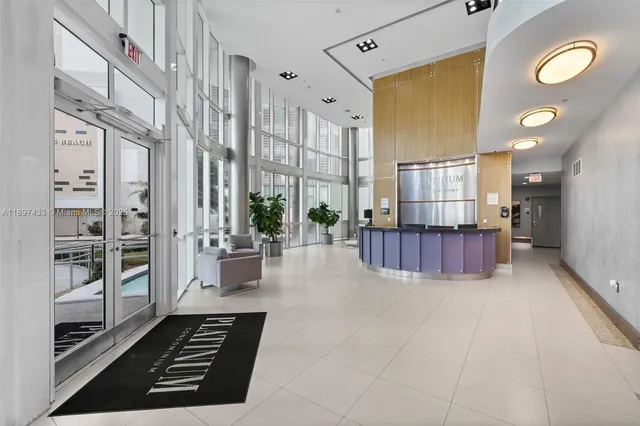 a view of kitchen with furniture and large window