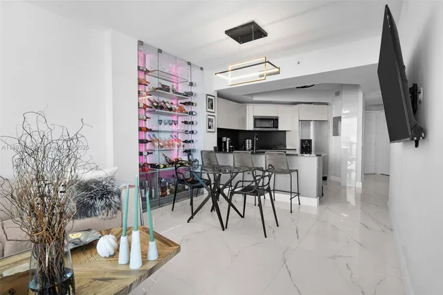 a view of a livingroom with furniture and a flat screen tv