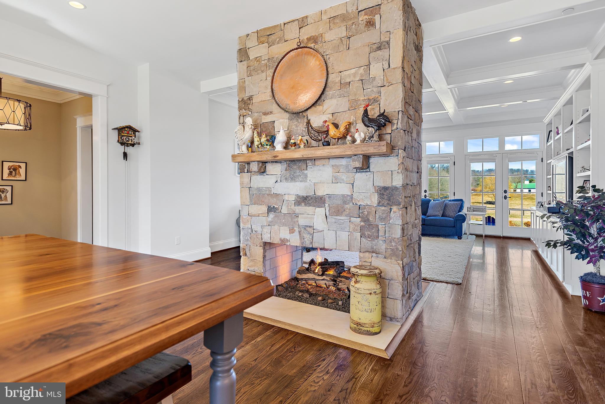 12962 Highland Road Highland, MD 20777 - Photo 22 of 74 Two-Sided Gas Fireplace from Kitchen to Family Rm