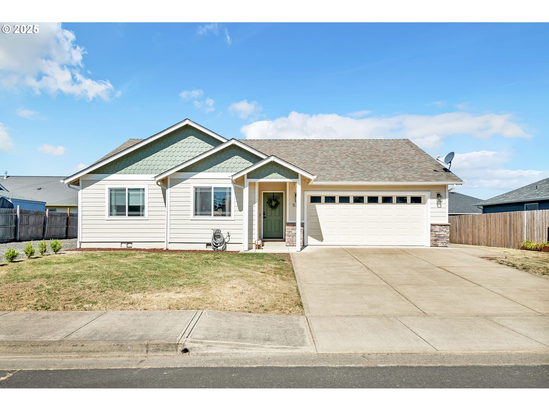 a view of a house with a yard and sitting area