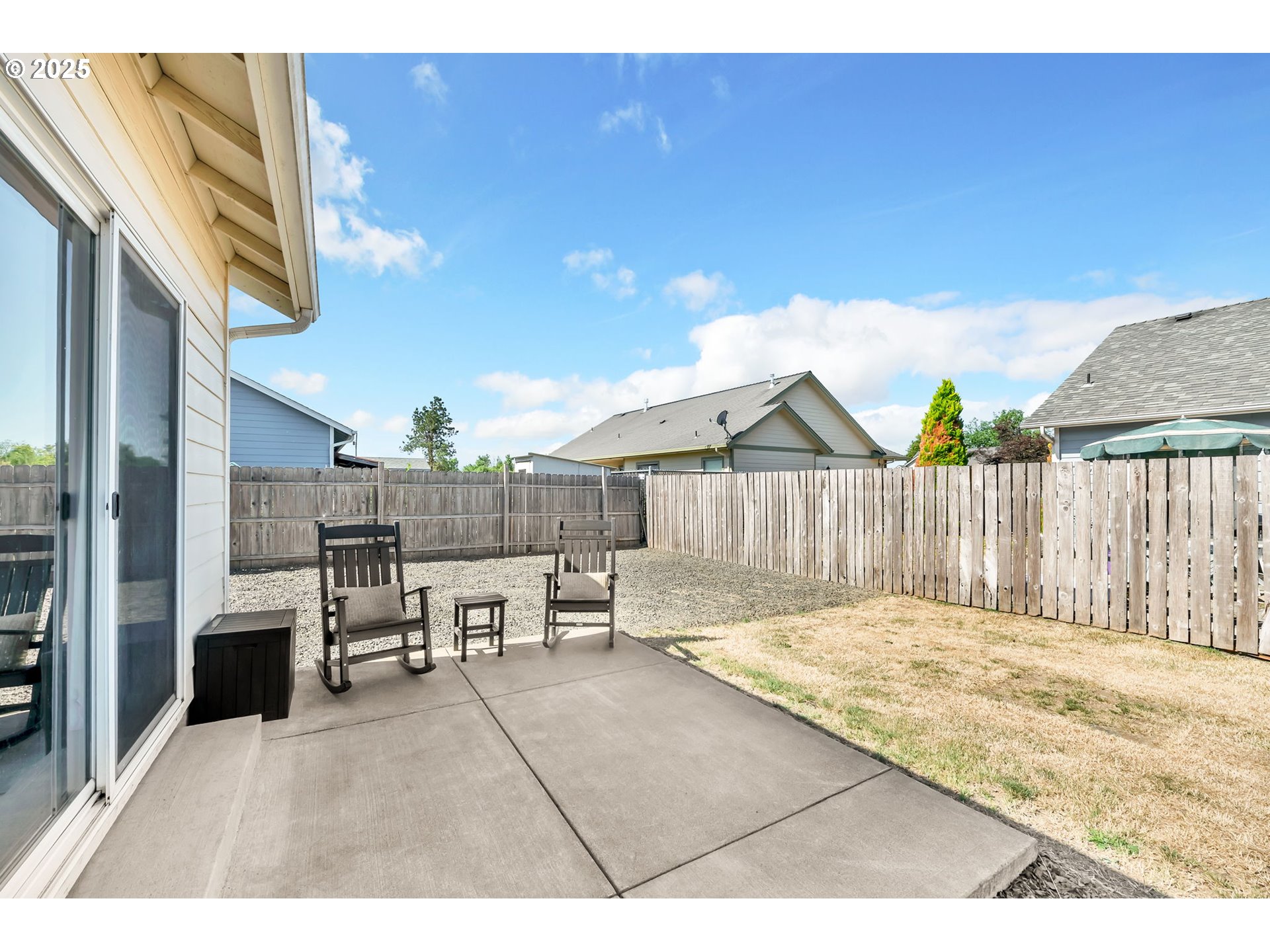 525 12th Street Aumsville, OR 97325 - Photo 19 of 23 a view of a patio with a table and chairs