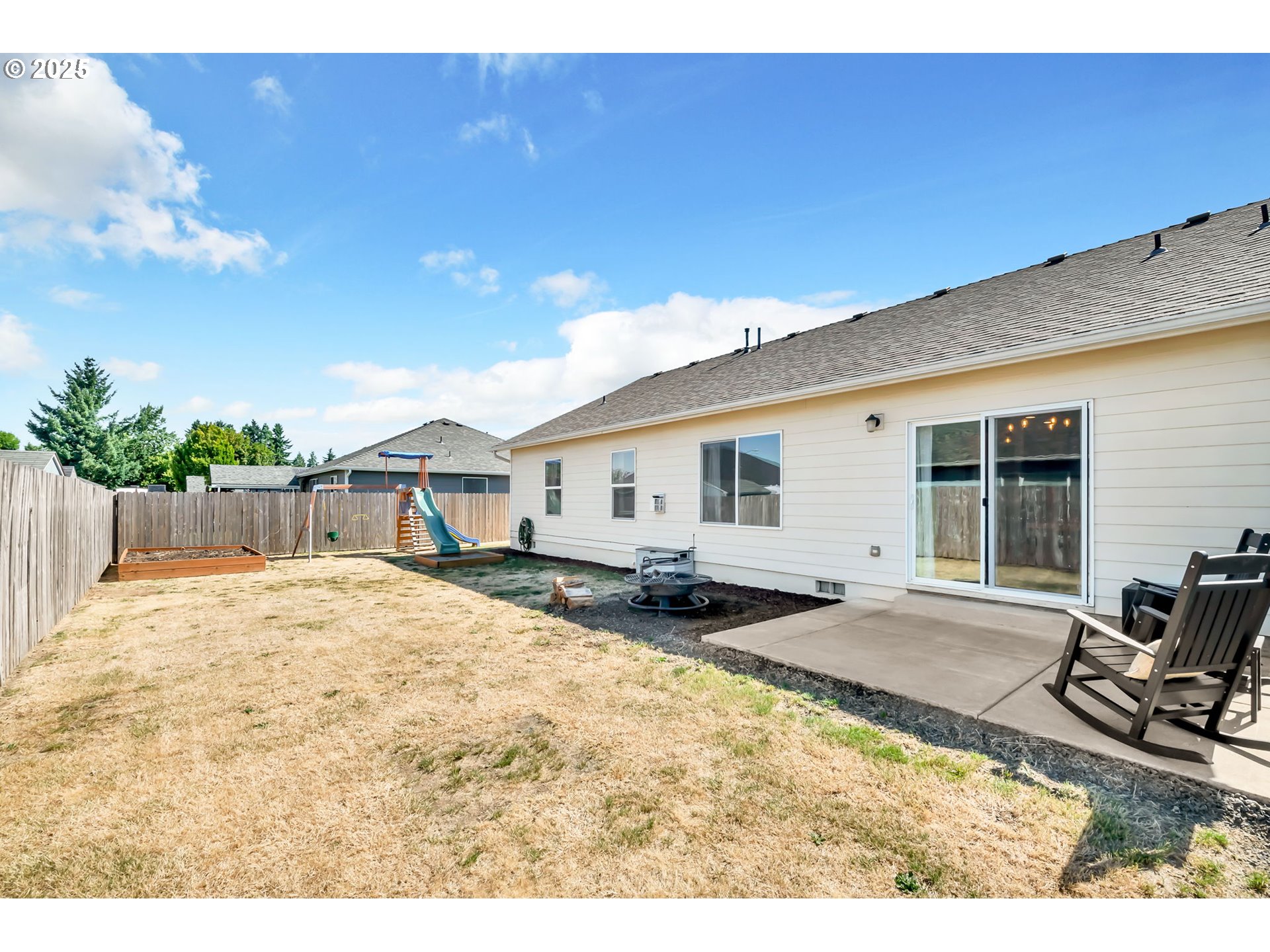 525 12th Street Aumsville, OR 97325 - Photo 21 of 23 a swimming pool with outdoor seating and yard in the back