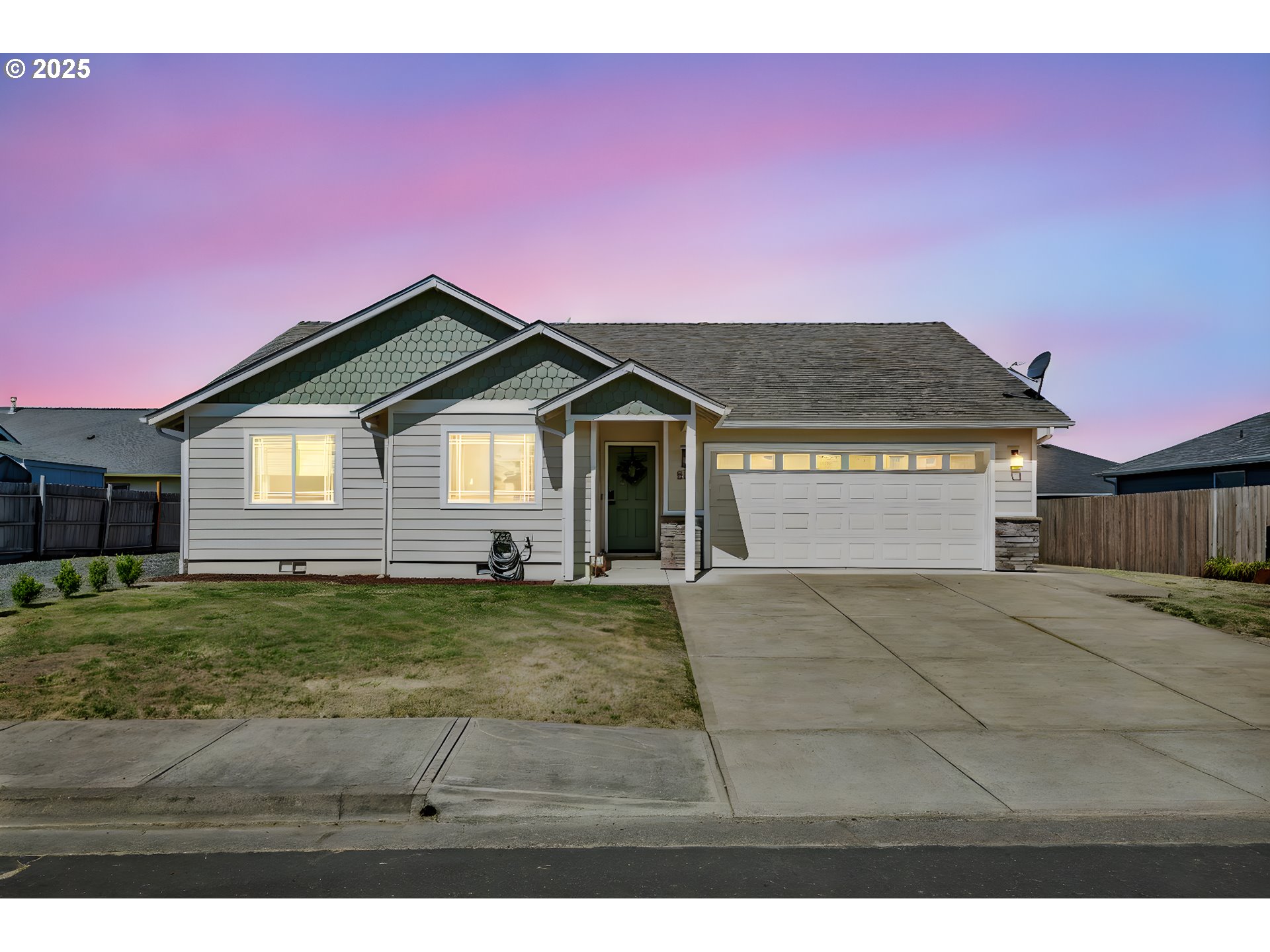 525 12th Street Aumsville, OR 97325 - Photo 23 of 23 a front view of a house with a yard and garage
