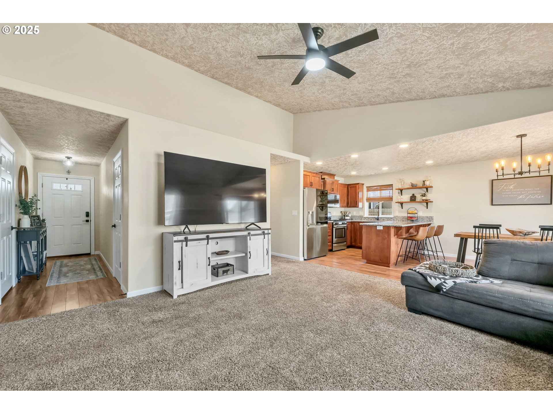 525 12th Street Aumsville, OR 97325 - Photo 4 of 23 a living room with furniture and a flat screen tv