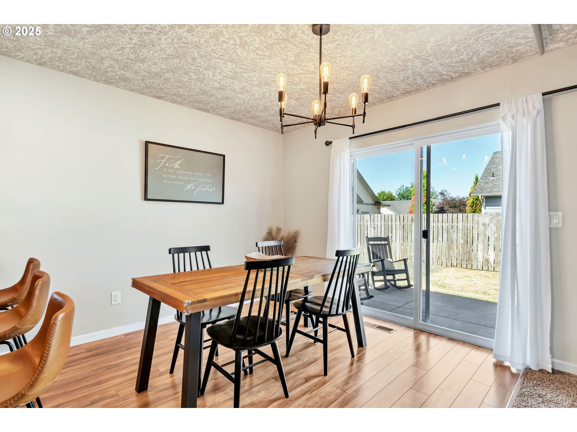 525 12th Street Aumsville, OR 97325 - Photo 9 of 23 a view of a dining room with furniture window and wooden floor