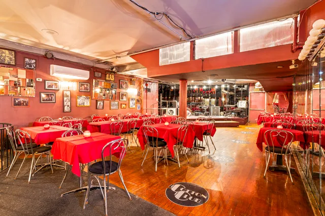 a view of a chairs and tables in the back yard of the house